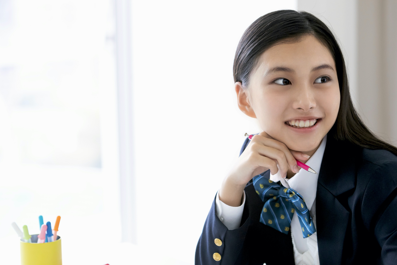 Portrait Japanese School Girl Sitting in Downtown Stock Image