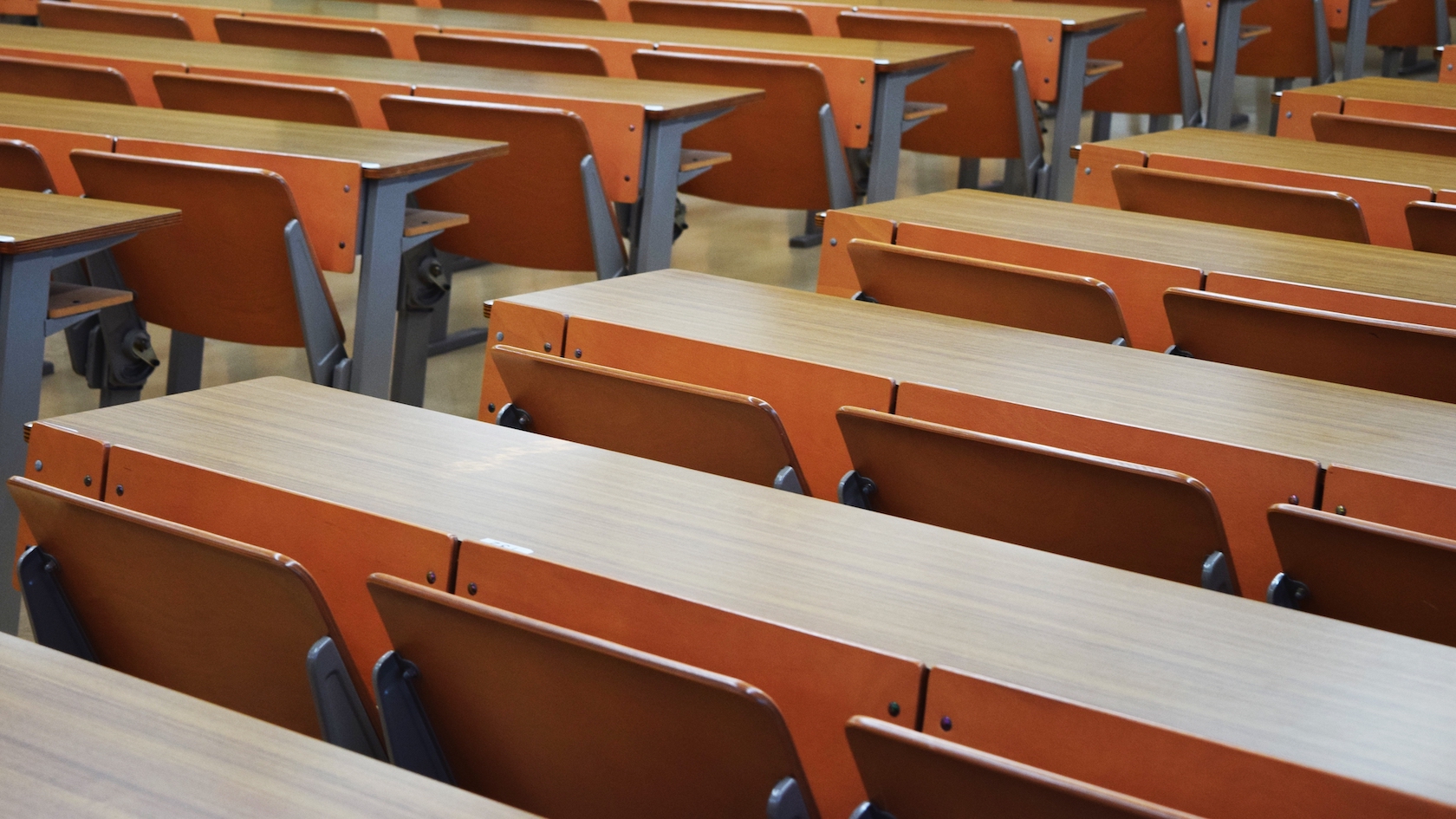 Adobe Stock 306872208. Desks in a Japanese university lecture hall.